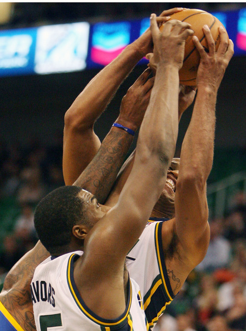 Steve Griffin  |  The Salt Lake Tribune

Utah's Derrick Favors and Richard Jefferson fight for a rebound during second half action in the Jazz versus Golden State preseason NBA basketball game at the EnergySolutions Arena in Salt Lake City, Utah Tuesday, October 8, 2013.