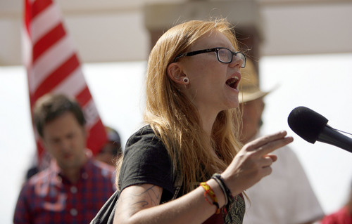 Francisco Kjolseth  |  The Salt Lake Tribune
Activist Macey Booth of Salt Lake speaks out "you are using the First amendment to speak out and say you want your 4th amendment back!" while joining opponents of the NSA Data Center during a peaceful protest on the 4th of July near the new facility along Redwood road.