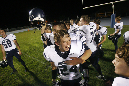 Scott Sommerdorf   |  The Salt Lake Tribune
Dylan Despain, center, and other Duchesne Eagles celebrate their easy 35-0 win over Carbon High in Price, Friday, September 6, 2013. Dylan Despain's five older brothers have played for Duchesne High. Duchesne beat Carbon 35-0 for their 37th win in a row and set the Utah state record for consecutive wins.