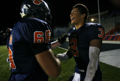 Scott Sommerdorf   |  The Salt Lake Tribune
Brighton RB Osa Masinagets congratulations from some of his offensive linemen on the sidelines after gaining 242 yards against Alta. Brighton defeated Alta 38-28, Friday, September 27, 2013