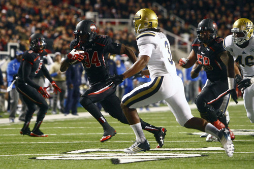 Chris Detrick  |  The Salt Lake Tribune
Utah Utes running back James Poole (34) runs past UCLA Bruins safety Randall Goforth (3) during the first half of the game at Rice-Eccles Stadium Thursday October 3, 2013. UCLA is winning the game 21-17.