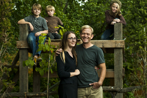 Chris Detrick  |  The Salt Lake Tribune
Phil Sherburne and his wife Leia Bell pose for a portrait with their kids Cortez, 11, Oslo, 6, and Ivan, 9, at their home in Salt Lake City Wednesday October 9, 2013. Sherburne and Bell, owners of the frame and art store called Signed & Numbered, succeeded on Oct. 5 in signing up for health coverage on healthcare.gov.