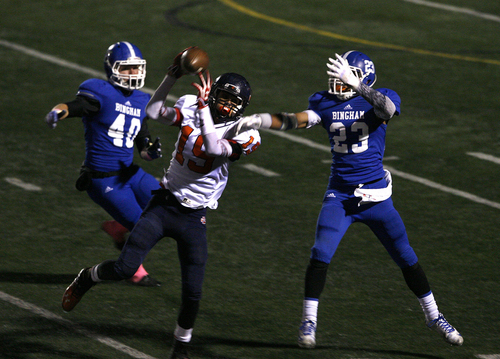 Scott Sommerdorf   |  The Salt Lake Tribune
Brighton WR Semi Fehoko grabs a pass late in the fourth quarter while being defended by Bingham's Skyler Olsen, 40, and Sky Manu, 23, as Bingham beat Brighton 38-27, Friday, October 4, 2013.