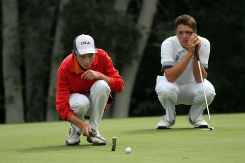 Francisco Kjolseth  |  The Salt Lake Tribune
Andrew Reilly, left, of Brighton lines up a putt as Zane Loveland of Lone Peak waits his turn on the 14th while competing in the 5A boys' state golf tournament at the Alpine Country Club in Highland on Tuesday, Oct. 8, 2013.