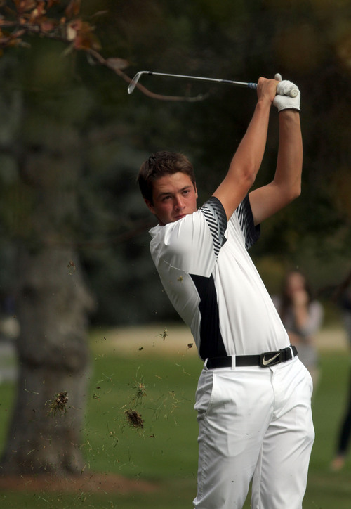 Francisco Kjolseth  |  The Salt Lake Tribune
Bringing up turf, Zane Loveland of Lone Peak keeps his eye on his ball as he competes in the 5A boys' state golf tournament at the Alpine Country Club in Highland on Tuesday, Oct. 8, 2013.