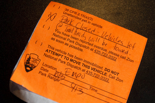 Trent Nelson  |  The Salt Lake Tribune
A warning note left by rangers on a vehicle that stopped in Zion National Park, which remains closed due to the government shutdown, Wednesday, October 9, 2013.