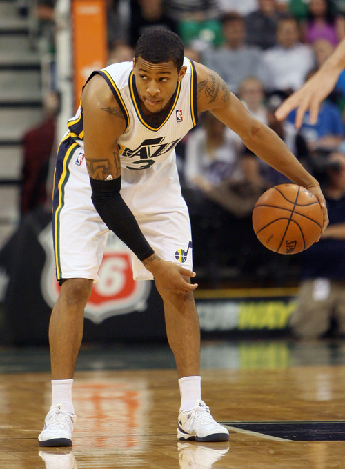 Steve Griffin  |  The Salt Lake Tribune

Utah's Trey Burke looks to the sideline as he runs the clock down during first half action in the Jazz versus Golden State preseason NBA basketball game at the EnergySolutions Arena in Salt Lake City, Utah Tuesday, October 8, 2013.