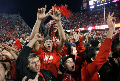 Scott Sommerdorf   |  The Salt Lake Tribune
Utah fans who stormed the field celebrate the win over Stanford. Utah upset #5 Stanford 27-21, Saturday, October 12, 2013.