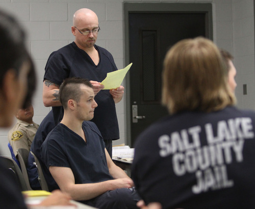 Rick Egan  | The Salt Lake Tribune 

John P. Stickney reads a poem during the Graveyard GOGI (Getting Out by Going In) class at Salt Lake County's Oxbow Jail. Stickney was released from the jail in September. Monday, August 26, 2013.