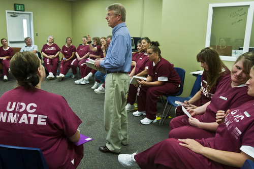 Chris Detrick  |  The Salt Lake Tribune

GOGI coach Roark Stratton teaches during a Getting Out by Going In (GOGI) class in the Timpanogos women's facility at Utah State Prison. "It's very rewarding to see them change, to see hope come into their lives," he said later. Tuesday August 6, 2013. GOGI is a non-profit organization that helps at-risk and incarcerated individuals make better choices by changing unhealthy patterns of thought and behavior.