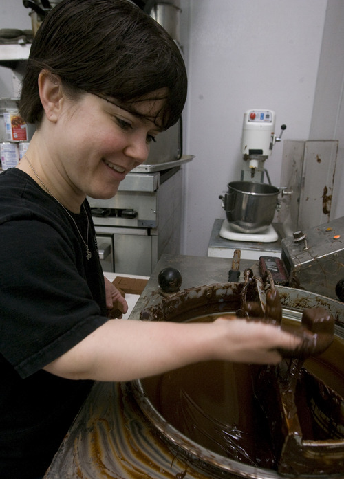 Rick Egan   |  The Salt Lake Tribune

Katie Masterson, dips chocolates, at Hatch Family Chocolates in February 2010.