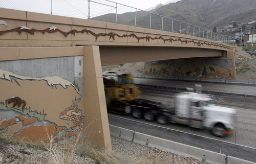 Francisco Kjolseth  |  Tribune file photo
Traffic moves along I-215 under the 3300 South bridge in Salt Lake on Wednesday, March 30, 2011. Utahís highway bridges now rank among the safest in the nation, but still have room for improvement, says a new national report. The new safety status is in large part due to the recent highway improvements along the I-15, I-80 and the I-215 corridors.