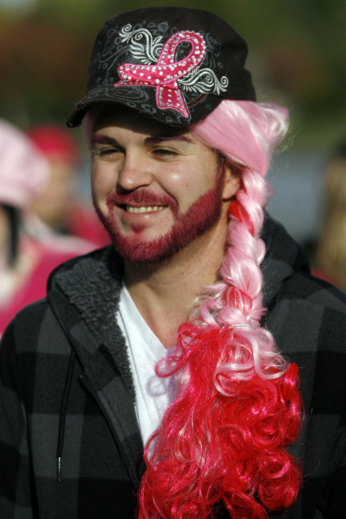 Keith Johnson | The Salt Lake Tribune
 
Jason Arias sports pink facial hair and a pink wig while participating in the Making Strides Against Breast Cancer walk at Liberty Park in Salt Lake City, October 12, 2013.