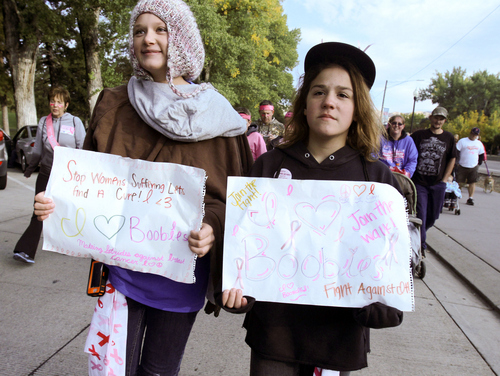 Keith Johnson | The Salt Lake Tribune
 
Bailey Poulson, left, and Kennedy Moore participate in the Making Strides Against Breast Cancer walk at Liberty Park in Salt Lake City, October 12, 2013.