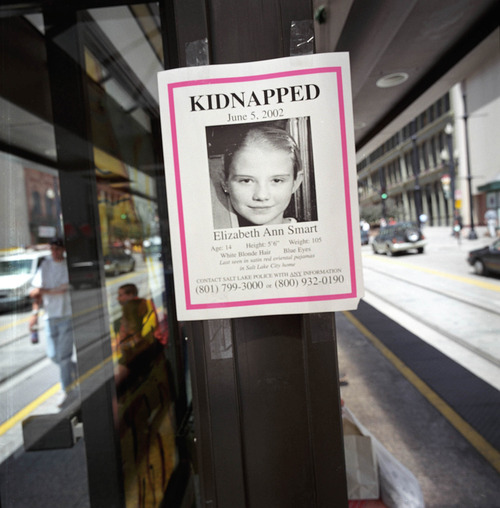Francisco Kjolseth | The Salt Lake Tribune 
Two weeks following the kidnapping of Elizabeth Smart few answers had developed, while posters of the missing girl were posted all over the city. (06/18/2002)