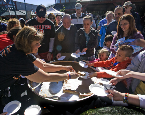 Rick Egan  | The Salt Lake Tribune 

Pie lovers crowd around a giant pumpkin pie, at the Utah Giant Pumpkins annual pumpkin weigh-off at Thanksgiving Point on Saturday, September 28, 2013. The 391/2 inch pie weighed 56 1/2 lbs.