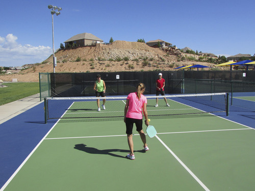 Tom Wharton  |  The Salt Lake Tribune
Denise Allen of St. George practices pickleball with Di Shanklin of Ivins and Marilyn Evans of St. George at Little Valley Pickleball Complex in St. George.