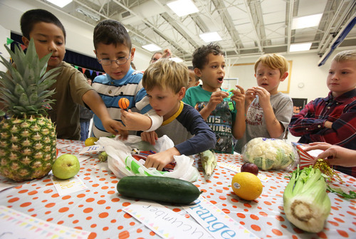 Francisco Kjolseth  |  The Salt Lake Tribune
Amelia Earhart Elementary School students in Provo learn about fruits and vegetables as they celebrate the beginning of National School Lunch Week with a Utah Nutrition Fair. Featured were BYU athletes, Blendtec Blenders making fresh smoothies, the BYU Food Science Club preparing food with liquid nitrogen, photo booths, face painting and other carnival games. Each station explains the importance of living a healthy lifestyle, how food can be fun and facts about the variety of fresh produce grown in Utah. This year, the national theme is ìSchool Lunch Across the USA.î