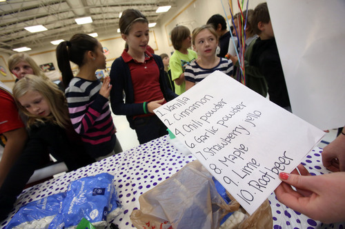 Francisco Kjolseth  |  The Salt Lake Tribune
Amelia Earhart Elementary School students in Provo try to figure out smells in unmarked containers as they celebrate the beginning of National School Lunch Week with a Utah Nutrition Fair. Featured were BYU athletes, Blendtec Blenders making fresh smoothies, the BYU Food Science Club preparing food with liquid nitrogen, photo booths, face painting and other carnival games. Each station explains the importance of living a healthy lifestyle, how food can be fun and facts about the variety of fresh produce grown in Utah. This year, the national theme is "School Lunch Across the USA."