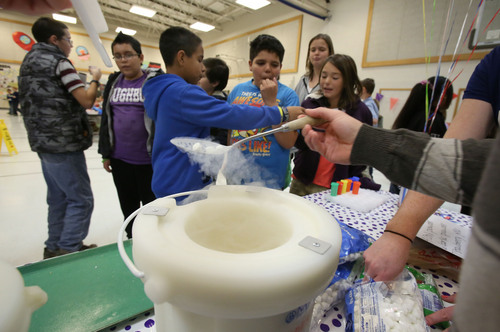 Francisco Kjolseth  |  The Salt Lake Tribune
Amelia Earhart Elementary School students get a chance to try liquid nitrogen frozen mini marshmallows in Provo as their school celebrates the beginning of National School Lunch Week with a Utah Nutrition Fair. Featured were BYU athletes, Blendtec Blenders making fresh smoothies, the BYU Food Science Club preparing food with liquid nitrogen, photo booths, face painting and other carnival games. Each station explains the importance of living a healthy lifestyle, how food can be fun and facts about the variety of fresh produce grown in Utah. This year, the national theme is "School Lunch Across the USA."