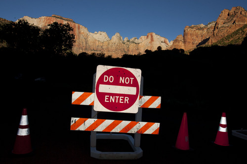 Steve Griffin  |  The Salt Lake Tribune

Signs block the entrance to the Zion Human History Museum in Zion National Park due to the federal government shutdown Tuesday October 1, 2013.