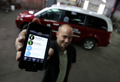 Francisco Kjolseth  |  The Salt Lake Tribune
Michael Norvell, a dispatch manager at Ute Cab in Salt Lake City shows off a relatively new mobile app called nextaxi that the company has been using for its customers to hail a cab, track it and pay for the ride through the app.