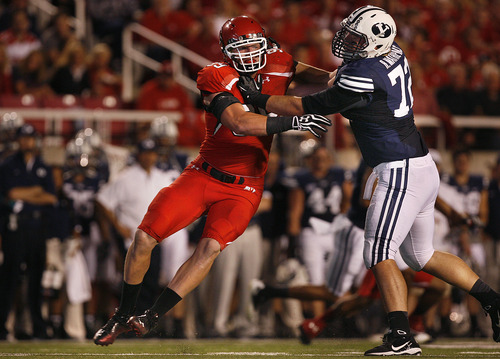 Scott Sommerdorf  |  The Salt Lake Tribune             
Utah Utes defensive end Joe Kruger (99) is blocked by Brigham Young Cougars offensive linesman Ryker Mathews (72) during first half play. Utah was tied with BYU 7-7 at the half, Saturday, September 15, 2012.