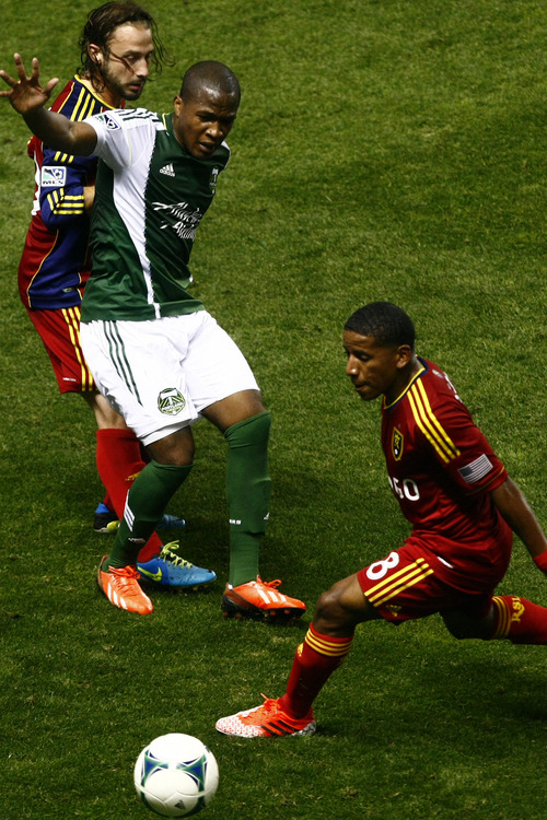 Chris Detrick  |  The Salt Lake Tribune
Real Salt Lake midfielder Ned Grabavoy (20) Portland Timbers forward/midfielder Darlington Nagbe (6) and Real Salt Lake forward Jou Plata (8) go for the ball during the first half of the game at Rio Tinto Stadium Friday August 30, 2013.