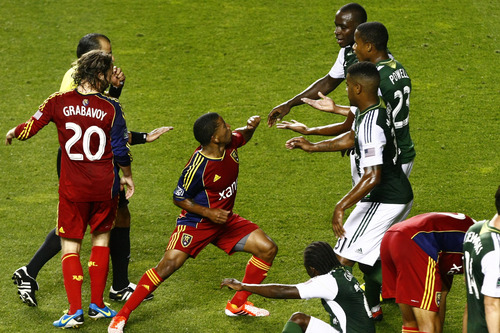 Chris Detrick  |  The Salt Lake Tribune
Real Salt Lake forward Jou Plata (8) and Portland Timbers defender Andrew Jean-Baptiste (35) get into a fight during the first half of the game at Rio Tinto Stadium Friday August 30, 2013.