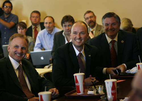Scott Sommerdorf   |  The Salt Lake Tribune
Rep. Spencer Cox, R-Fairview, center, smiles as he is the topic of a speech by Rep. Don Ipson, R-St.George in the Republican Caucus meeting prior to the special session. Utah lawmakers meet in special session about parks funding and the Senate confirmed Cox as the new lieutenant governor, Wednesday, October 16, 2013.