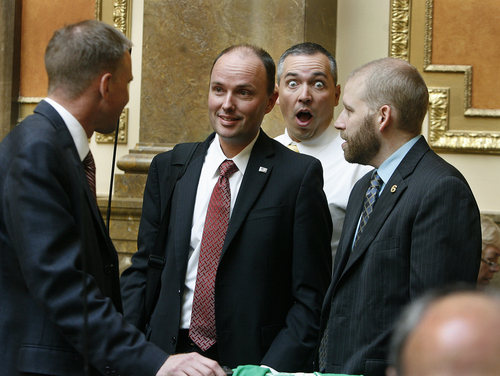Scott Sommerdorf   |  The Salt Lake Tribune
Rep. Dan McKay, R-Riverton, "photobombs" a situation with soon-to-be Lt. Gov. Spencer Cox during some of his last minutes on the House floor as a representative. To the far left is Rep. Craig Hall, R-West Valley City. At far right is Joe Pyrah, chief of staff to the Speaker of the House. Utah lawmakers met Wednesday in special session about parks funding and the Senate confirmed Cox as the new lieutenant governor, Wednesday, October 16, 2013.