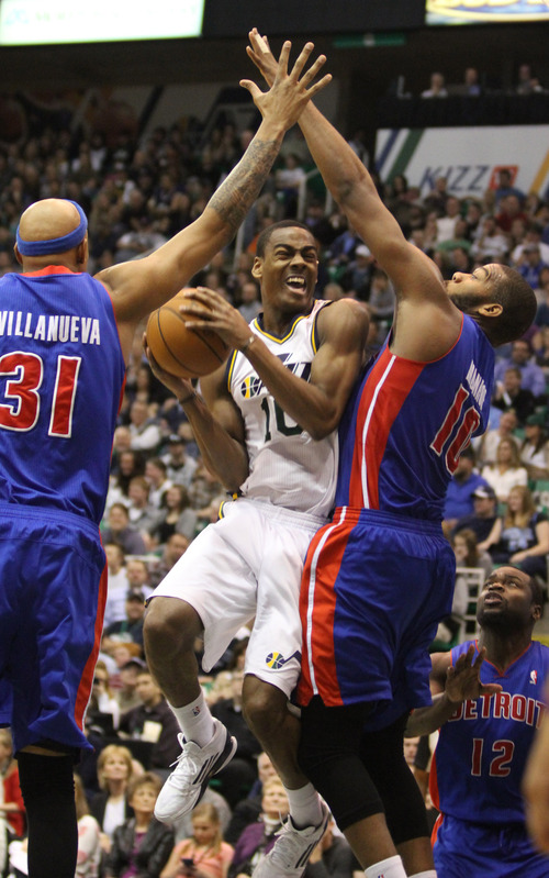 Rick Egan  | The Salt Lake Tribune 

Utah Jazz point guard Alec Burks (10) tries to get off a shot as he is doubled teamed by Detroit Pistons power forward Charlie Villanueva (31) and Greg Monroe (10), in NBA action, Utah vs. Detroit, at EnergySolutions Arena, Monday, March 11, 2013.