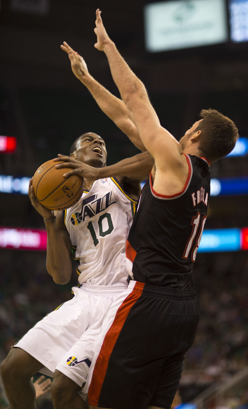 Lennie Mahler  |  The Salt Lake Tribune
Alec Burks puts up a shot over Portland's Meyers Leonard as the Jazz face the Blazers at EnergySolutions Arena on Wednesday, Oct. 16, 2013.