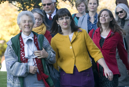 Rick Egan  | The Salt Lake Tribune 

Nadine Hansen (left) and Katie Kelly (yellow)  lead the group Ordain Women as they walk to LDS Conference Center to stand in the standby line to try to gain admittance to the Priesthood session of the 183rd Semi-annual General Conference, Saturday, October 5, 2013.