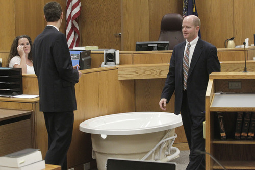 Al Hartmann  |  The Salt Lake Tribune
Defense attorney Randy Spencer, left, and prosecuter Chad Grunander check out the bathtub put in place in Judge Derek Pullan's 4th Distirct Courtroom Friday October 18. The tub was used to approximate Michele MacNeill's body position when neighbor Kristi Daniels found Martin MacNeill trying to help his wife. He is charged with murder for allegedly killing his wife, Michele, in 2007.