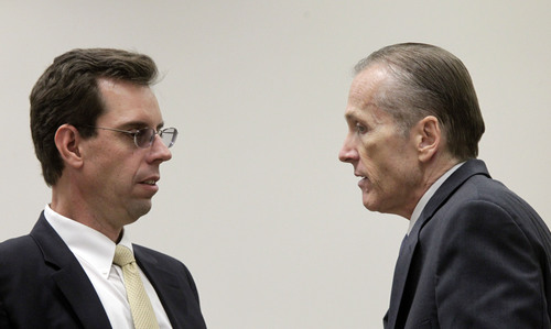 Al Hartmann  |  The Salt Lake Tribune
Defense lawyer Randy Spencer, left, talks with his client Martin MacNeill in 4th District Court Friday Ocotber 18. The Pleasant Grove physician is charged with murder for allegedly killing his wife, Michele MacNeill, in 2007 so he could continue an extra-marital affair.