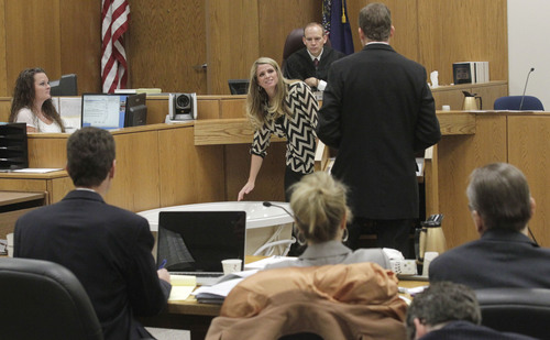 Al Hartmann  |  The Salt Lake Tribune
Neighbor Kristi Daniels leans over bathtub to describe Michele MacNeill's body position when she was called to the home for help in 2007. The tub was brought into Judge Derek Pullan's 4th District courtroom Friday Ocotber 18. Prosecuter Jared Perkins, right, questions her and Judge Pullan watches above.