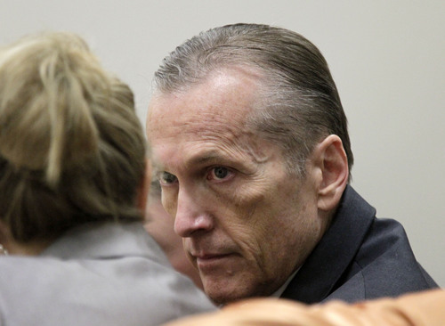 Al Hartmann  |  The Salt Lake Tribune
Pleasant Grove physician Martin MacNeill, charged with murder for allegedly killing his wife, Michele MacNeill, in 2007 speaks to his defense lawyer Susanne Gustin in Judge Derek Pullan's 4th District Court in Provo Friday October 18.