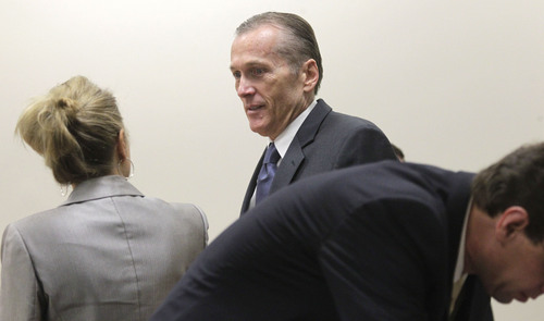 Al Hartmann  |  The Salt Lake Tribune
Pleasant Grove physician Martin MacNeill, charged with murder for allegedly killing his wife, Michele MacNeill, prepares for trial with defense lawyers Susanne Gustin and Randy Spencer in Judge Derek Pullan's 4th District Court in Provo Friday October 18.