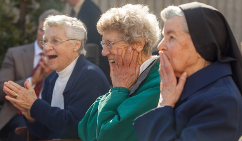 Trent Nelson  |  The Salt Lake Tribune
Sisters Danile Knight, Stephanie Mongeon and Luke Hoschette react as a monument honoring the Sisters of St. Benedict and their legacy at Ogden Regional Medical Center is unveiled at the center in Ogden, Thursday October 17, 2013.