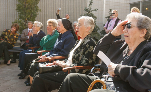 Trent Nelson  |  The Salt Lake Tribune
Sisters Danile Knight, Stephanie Mongeon, Luke Hoschette, Mary Zenzen and Jean Gibson react as a monument honoring the Sisters of St. Benedict and their legacy at Ogden Regional Medical Center is unveiled at the center in Ogden, Thursday October 17, 2013.