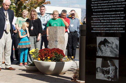 Trent Nelson  |  The Salt Lake Tribune
Onlookers watch the ceremony as a monument honoring the Sisters of St. Benedict and their legacy at Ogden Regional Medical Center is unveiled at the center in Ogden, Thursday October 17, 2013.
