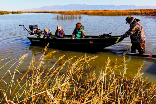 Trent Nelson  |  The Salt Lake Tribune
Gary Hinds and his children Matt, Morgan and Aimee, embark on a duck hunting trip at the Bear River Migratory Bird Refuge, Friday October 18, 2013.