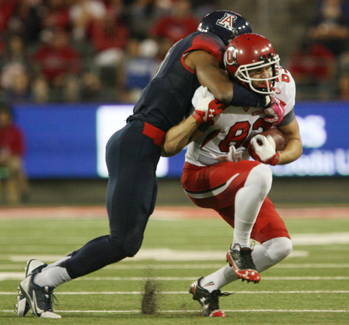 Steve Griffin  |  The Salt Lake Tribune

Utah Utes wide receiver Sean Fitzgerald (83) gets tackled by Arizona Wildcats cornerback Shaquille Richardson (5)during first half action in the University of Utah versus University of Arizona football game at Arizona Stadium in Tucson, Ariz., Saturday, October 19, 2013.