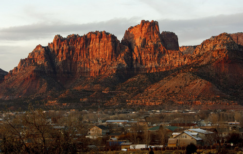 Trent Nelson | The Salt Lake Tribune
The twin cities of Colorado City, Arizona and Hildale, Utah. Here, the sun sets on the breathtaking Vermillion Cliffs overlooking the community. Non-profit organization Holding Out Help will open a new community center Oct. 19 in the Hildale, Utah, and Colorado City, Ariz., region.