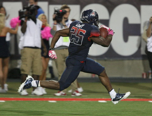 Steve Griffin  |  The Salt Lake Tribune

Arizona Wildcats running back Ka'Deem Carey (25) breaks the game open as he races to a touchdown during second half action in the University of Utah versus University of Arizona football game at Arizona Stadium in Tucson, Ariz., Saturday, October 19, 2013.