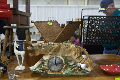 Chris Detrick  |  The Salt Lake Tribune
People look at antiques for sale during the Original Salt Lake Antique Show at the South Towne Exposition Center Saturday October 19, 2013. Dealers from around the country will be selling pottery, heirloom jewelry, textiles, fine art, country store antiques, Native American art and more. The show continues Sunday from noon to 5 p.m.