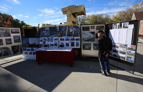Francisco Kjolseth  |  The Salt Lake Tribune
Lieutenant Colonel Grant Stansfield of the University of Utah ROTC, overlooks the memorobilia showing the country tour made by the Utah Fallen Warrior Memorial prior to its dedication at Fort Douglas on the University of Utah campus on Monday, Oct. 21, 2013. A big chunk of foundation from the World Trade Center, which is the key featured in the memorial, has been on a statewide tour for several weeks before its final resting place at the Fort Douglas Museum.
