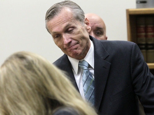 Martin MacNeill enters Judge Derek Pullan's 4th District Court for his trial in Provo, Utah, Thursday, Oct. 17, 2013. MacNeill, a former doctor, is charged with murder in the 2007 death of his wife. MacNeill, 57, was charged in August 2012, nearly five years after his former beauty queen wife, Michele MacNeill, was found in the bathtub at the couple's Pleasant Grove home, about 35 miles south of Salt Lake City. (AP Photo/The Salt Lake Tribune, Al Hartmann, Pool)