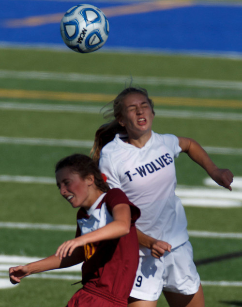 Trent Nelson  |  The Salt Lake Tribune
Mountain View's Olivia Hoddy and Timpanogos's Kami Warner leap for the ball, as Mountain View faces Timpanogos High School in a 4A girls state soccer semifinal match, Tuesday October 22, 2013.